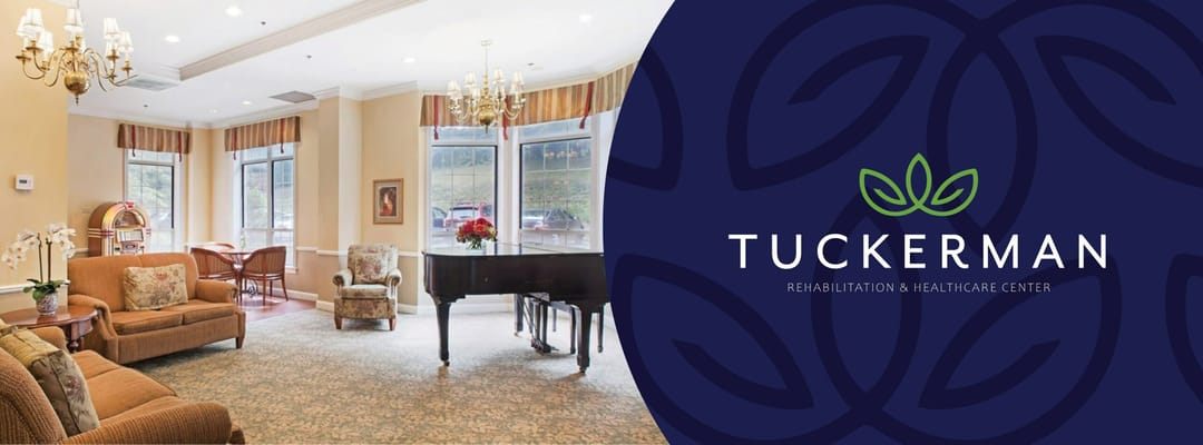 Bright common area with seating and a piano