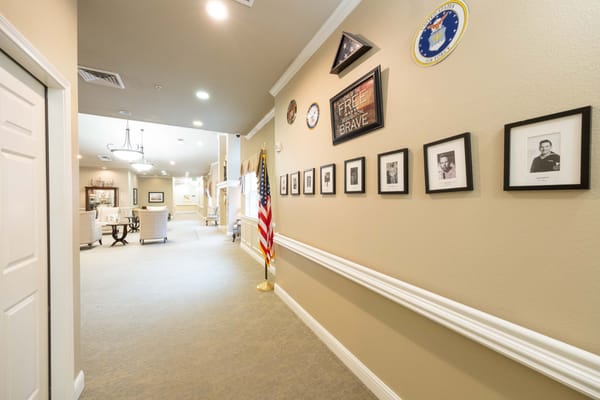 Interior hallway with military decorations and flag