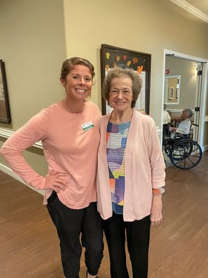 Staff member with a resident in a common area