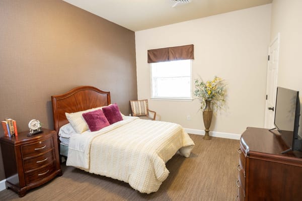 Cozy private bedroom with a bed and window