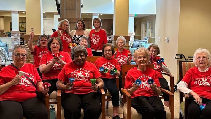 Residents participating in a fun bell ringing activity