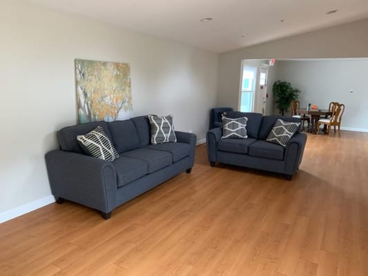 Common area with two upholstered sofas