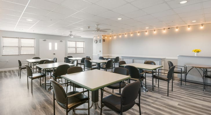 Interior view of a common area with seating and tables