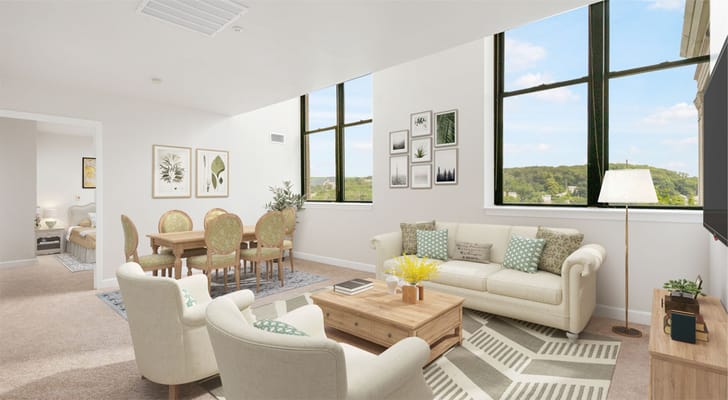 Bright common area with seating and dining space