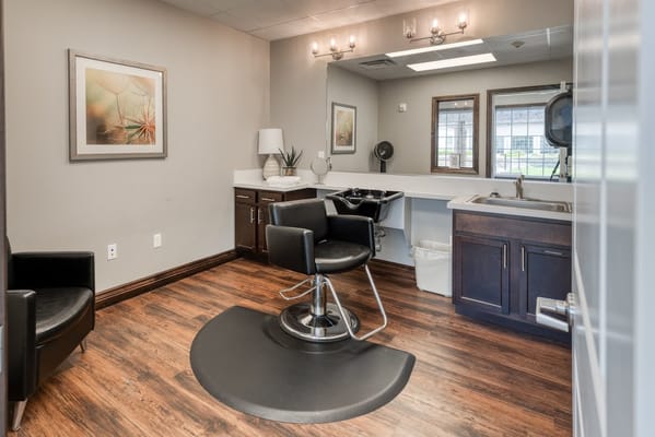 Interior view of a salon with a stylist chair