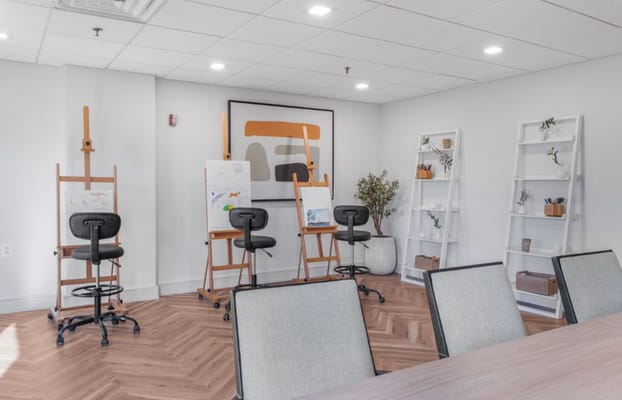 Art studio with easels and storage shelves