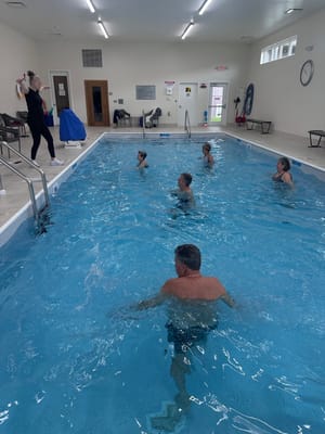 Residents participating in a water therapy class