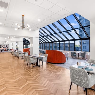 Bright dining room with large windows and modern decor