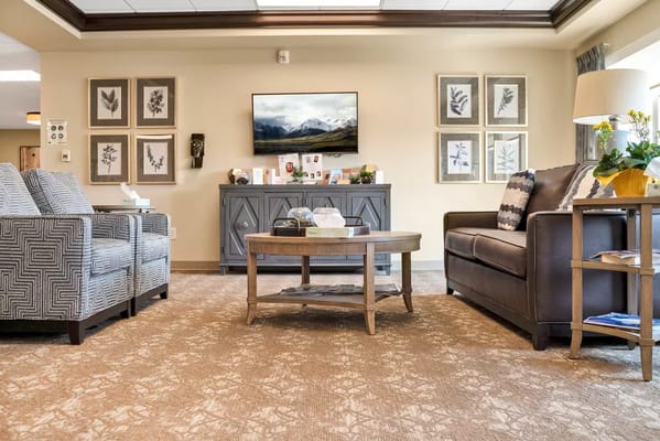 Cozy living room with comfortable seating and a television.