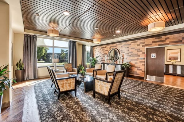 Spacious lobby area with comfortable seating and natural light