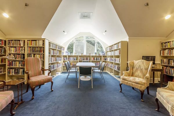 Cozy library with bookshelves and seating areas