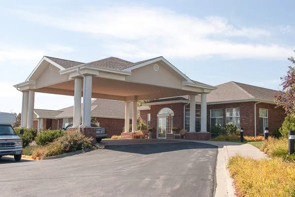 Front entrance of Life Care Center of Greeley with canopy and landscaping