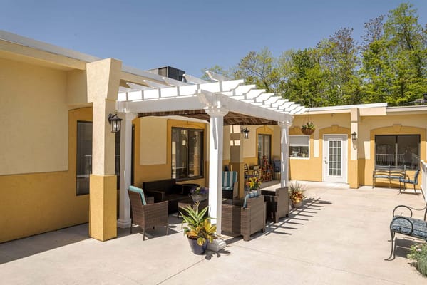 Outdoor patio area with seating and plants