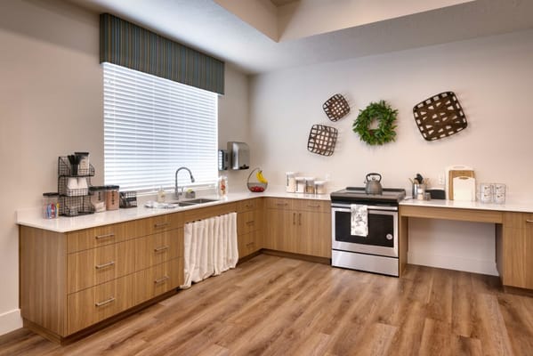 Bright kitchen area with modern appliances and decor