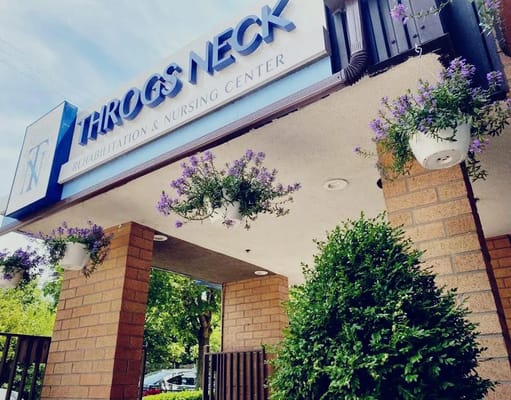 Facade of Throgs Neck Rehabilitation & Nursing Center adorned with flowers