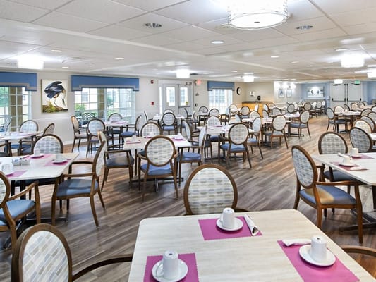 Dining area with tables set for residents