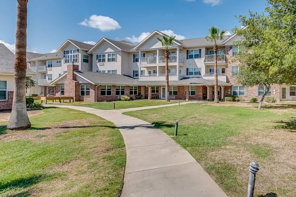 Exterior view of Solstice Senior Living at Corpus Christi with gardens