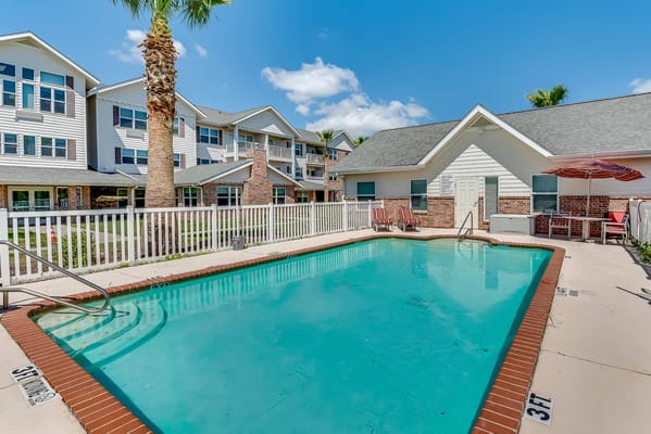 Swimming pool area surrounded by residential buildings