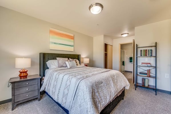 Bright and inviting private resident room with a bed