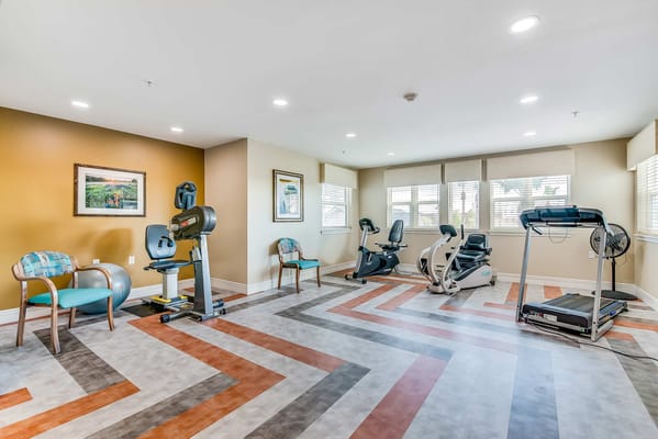 Well-equipped fitness room with exercise machines