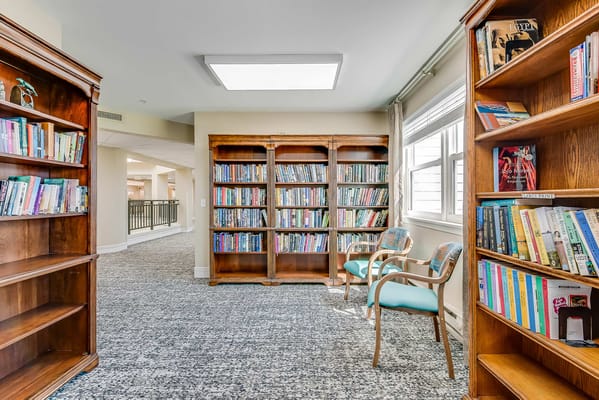Cozy reading nook with bookshelves and seating