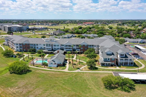 Aerial view of Solstice Senior Living campus with buildings and pool