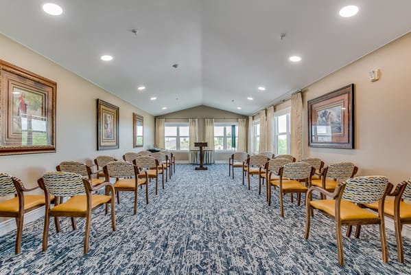 Interior view of a common area with chairs and art