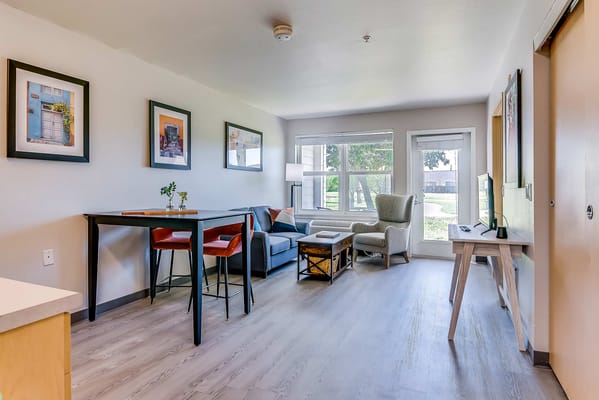 Cozy and well-decorated living room area in a senior living facility