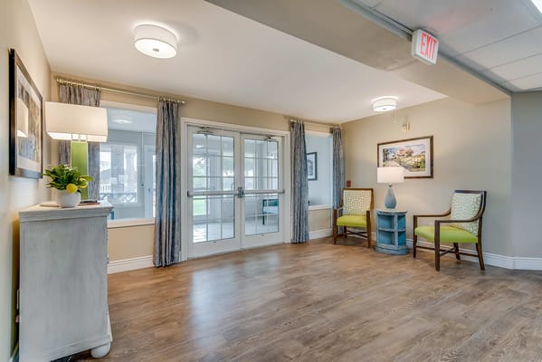 Bright interior lobby with seating area and artwork