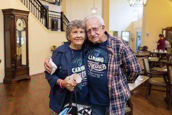 Residents smiling together in a communal area