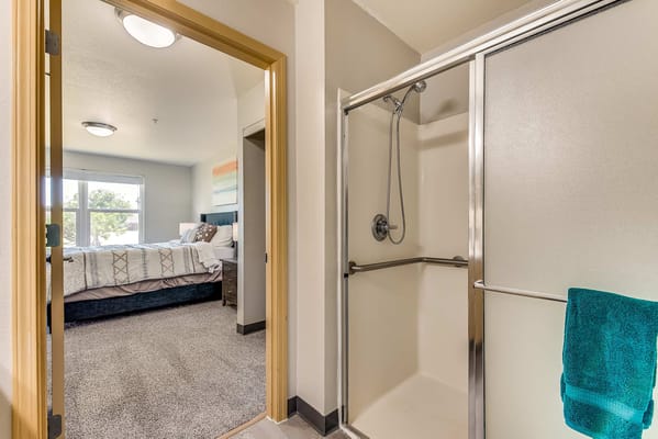 Interior view of a resident bathroom and bedroom