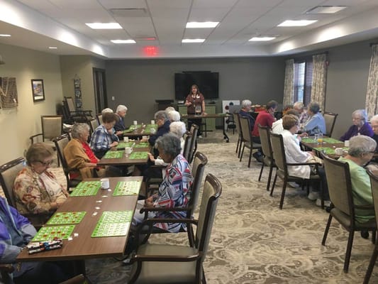 Residents playing bingo in an activity room