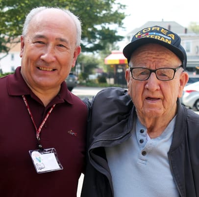 Two residents smiling outdoors together