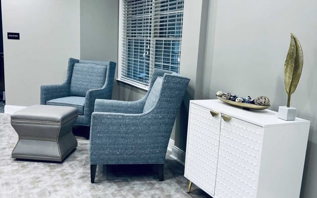 Cozy lounge area with chairs and decorative accents