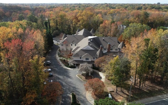 Aerial view of Charter Senior Living surrounded by fall foliage