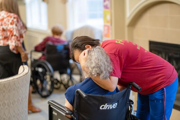 Staff member interacting with resident in a common area