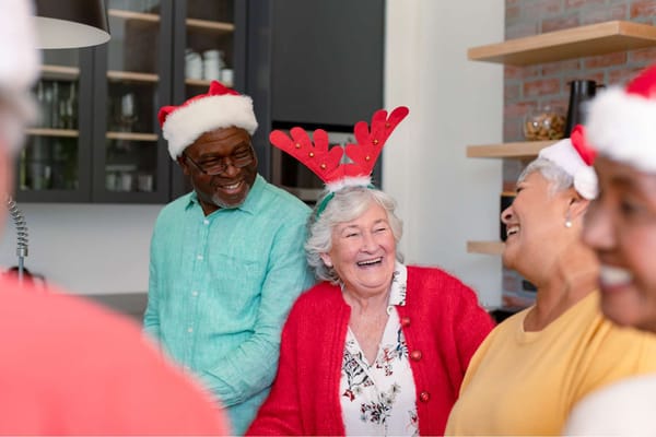 Residents celebrating with festive hats during a holiday event