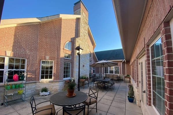 Outdoor patio area with tables and chairs