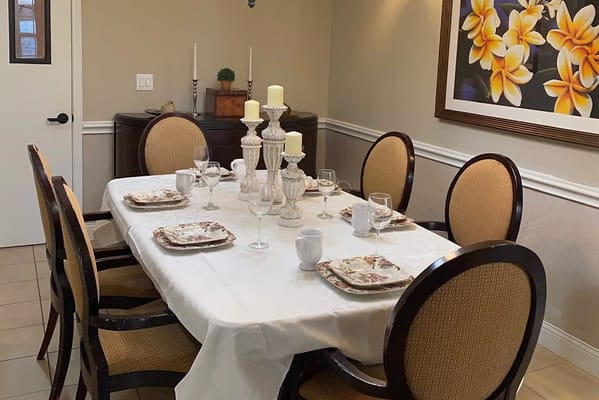 Dining area set for a meal with elegant decor