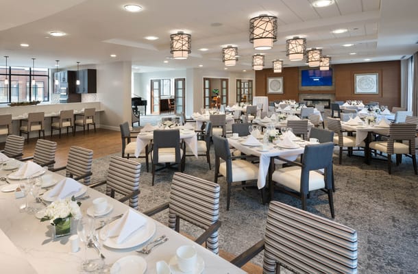 Elegant dining room setup with tables and soft lighting