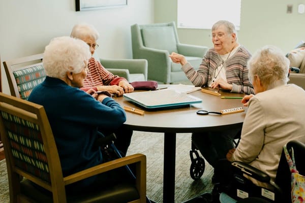 Residents enjoying a group activity at a table