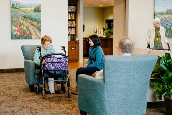 Residents interacting in a common area with seating