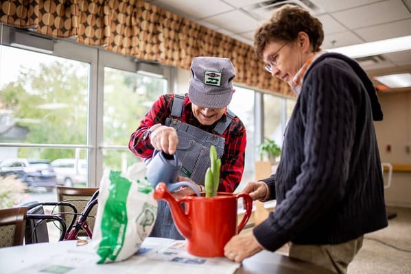 Residents engaged in gardening activity indoors