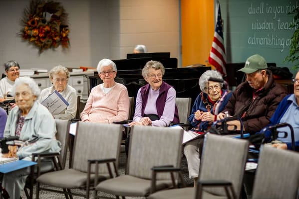 Residents participating in a group activity in the common area
