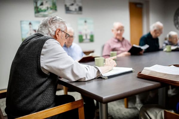 Residents participating in an activity in a common room