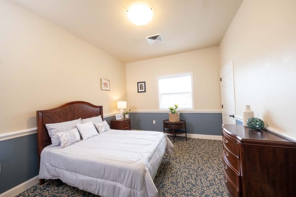 Private resident room with a bed and decor