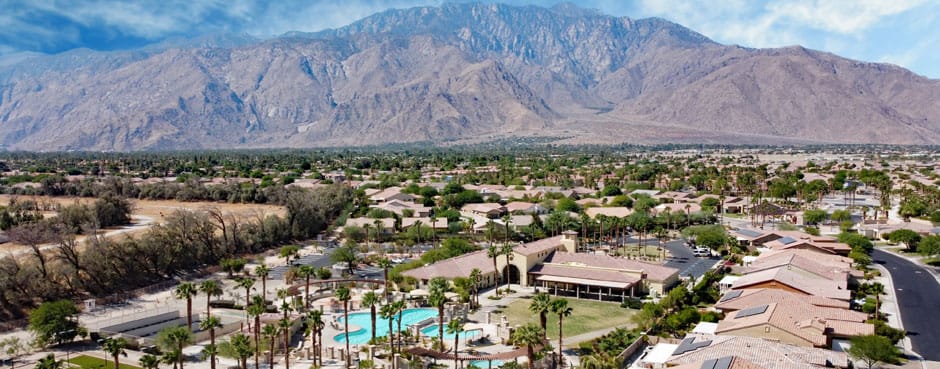 Aerial view of an assisted living community with a pool