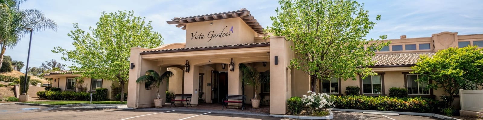 Exterior view of Vista Gardens Memory Care facility entrance