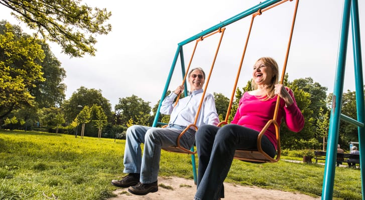 Residents enjoying a swing in an outdoor park