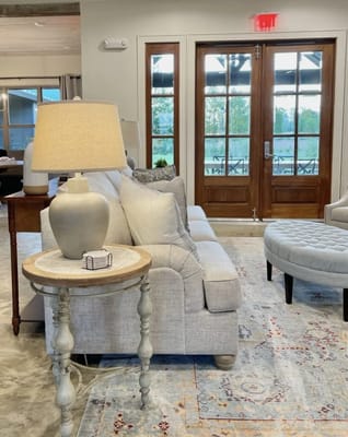 Cozy common area with a sofa and decorative lamp